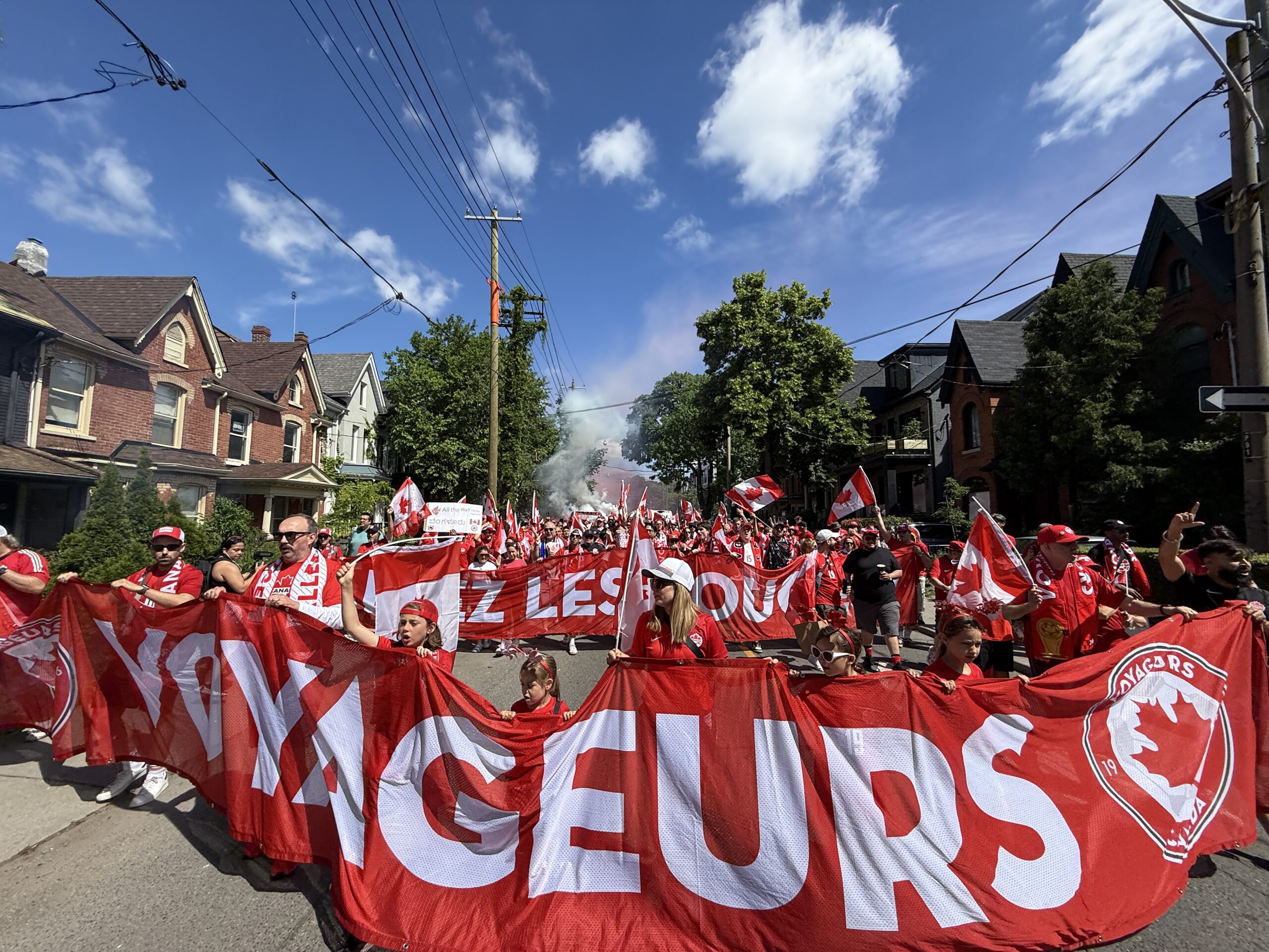 Supporters setting off flares along the route